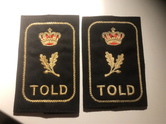 Axelklaffar Tull Danmark.