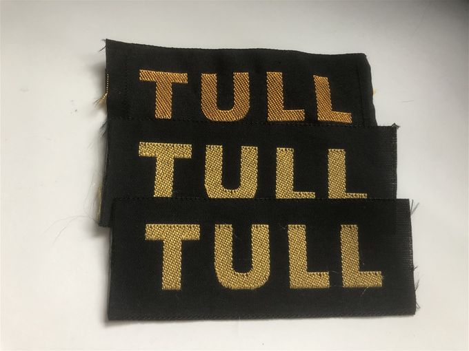 Tullen, Vävda bröstmärken.
